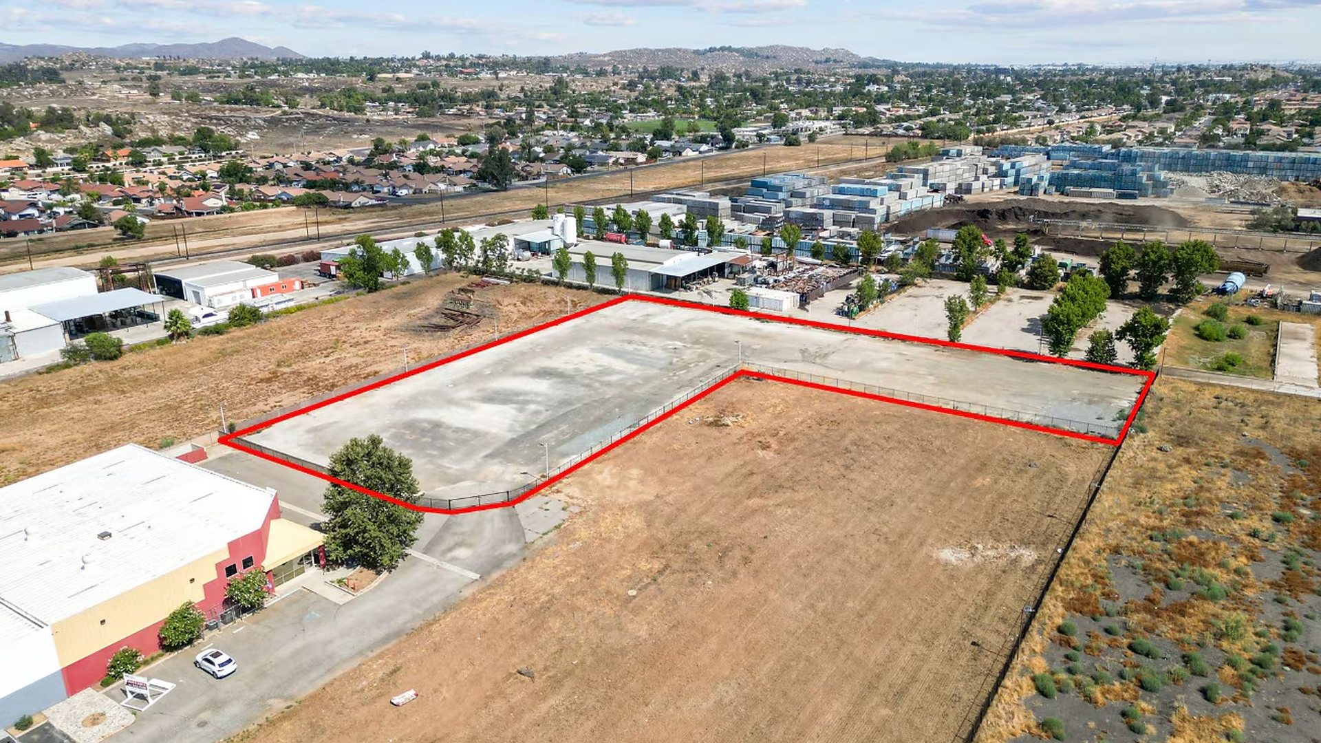 Drone image of the 334 Malbert St yard with neighboring industrial buildings